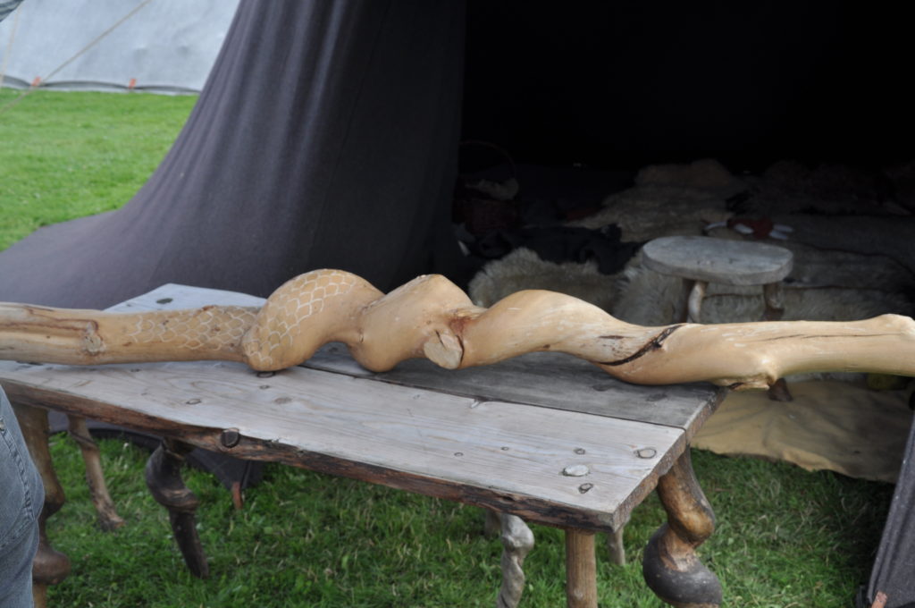 Carving a serpent out of wood at the Viking Market in Jelling, Denmark