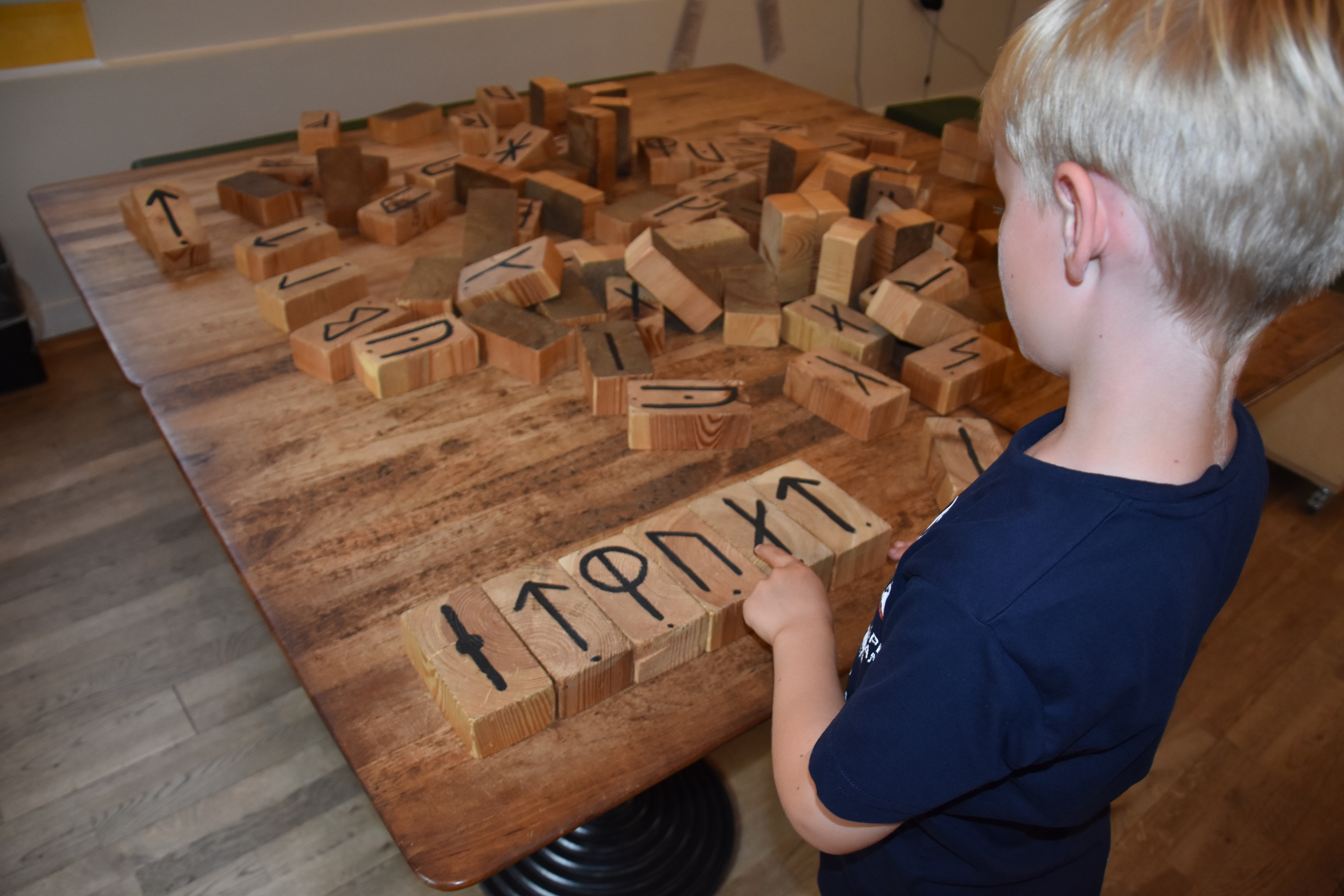 Playing with viking letters at the Viking Museum in Ribe, Denmark
